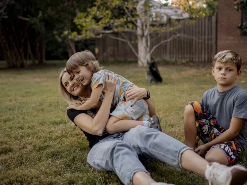 Mother playing with her two children