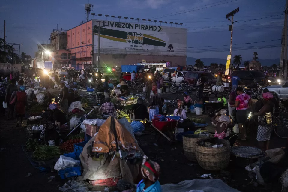 Bustling evening market scene with vendors and shoppers