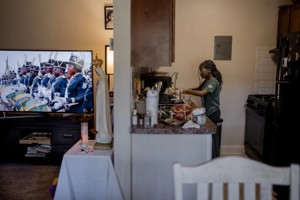 Marie Raphaelle, 10, attends the Back-to-School event with her mother Bernadette