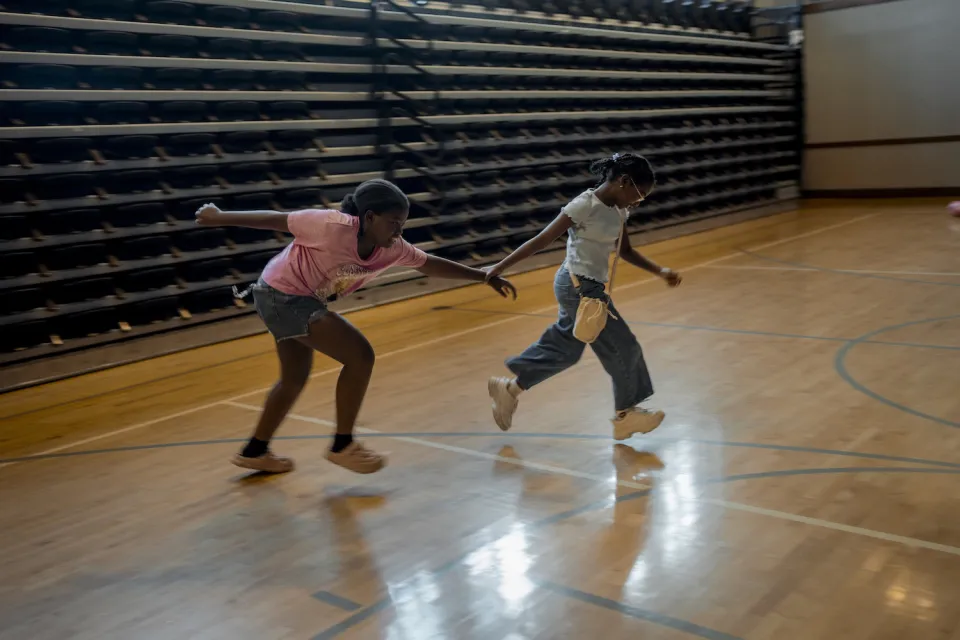 Marie Raphaelle plays with other children during the Back-to-School event at Holy Trinity