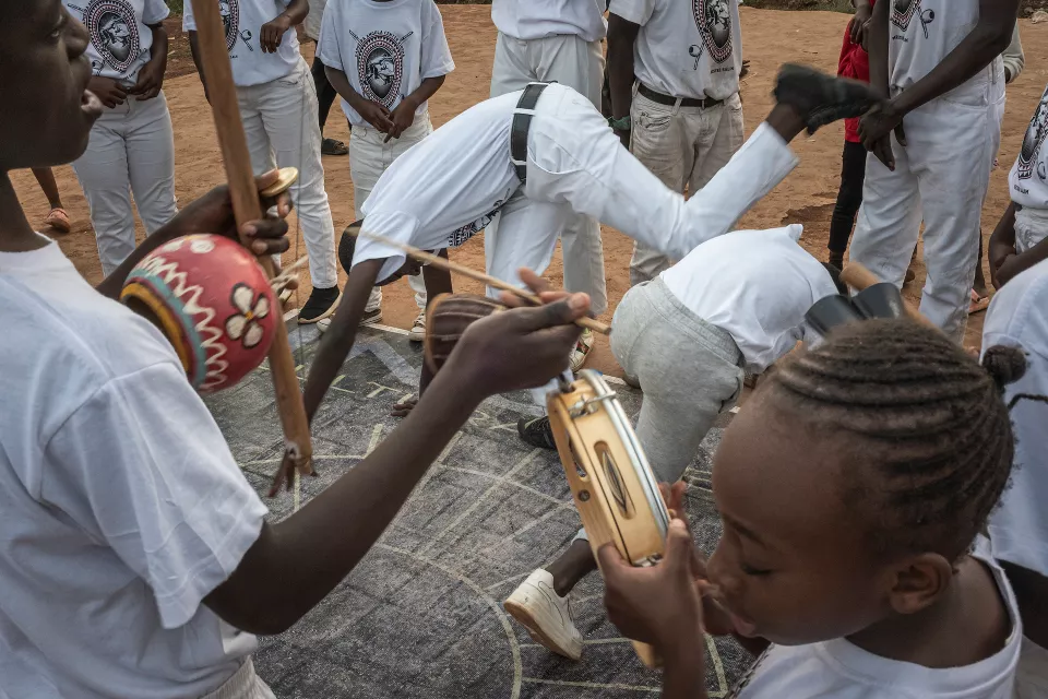 Group acrobatic performance with youth in white