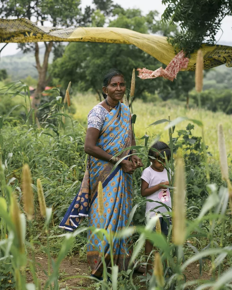 Woman in blue sari with yellow patterns