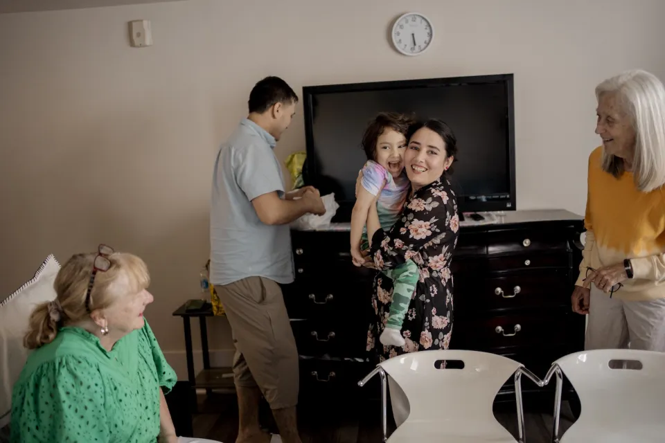 Hakima, Haroon and young Aslihan at home after their asylum hearing