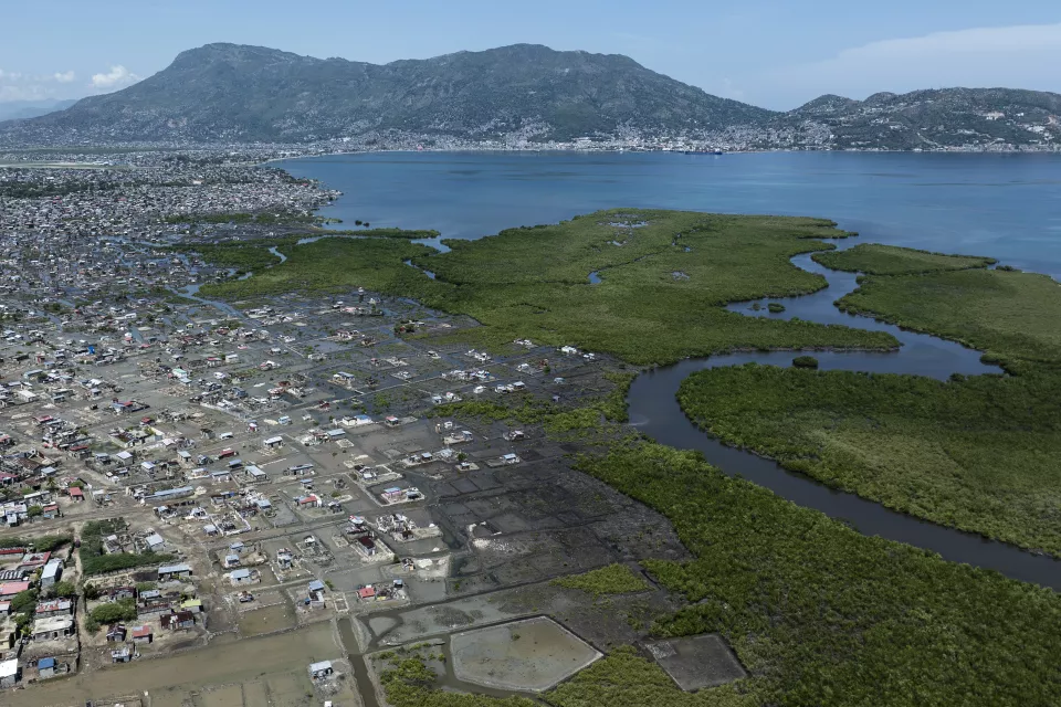 Image 21 (021): Aerial view of flooded coastal neighborhood with densely packed buildings